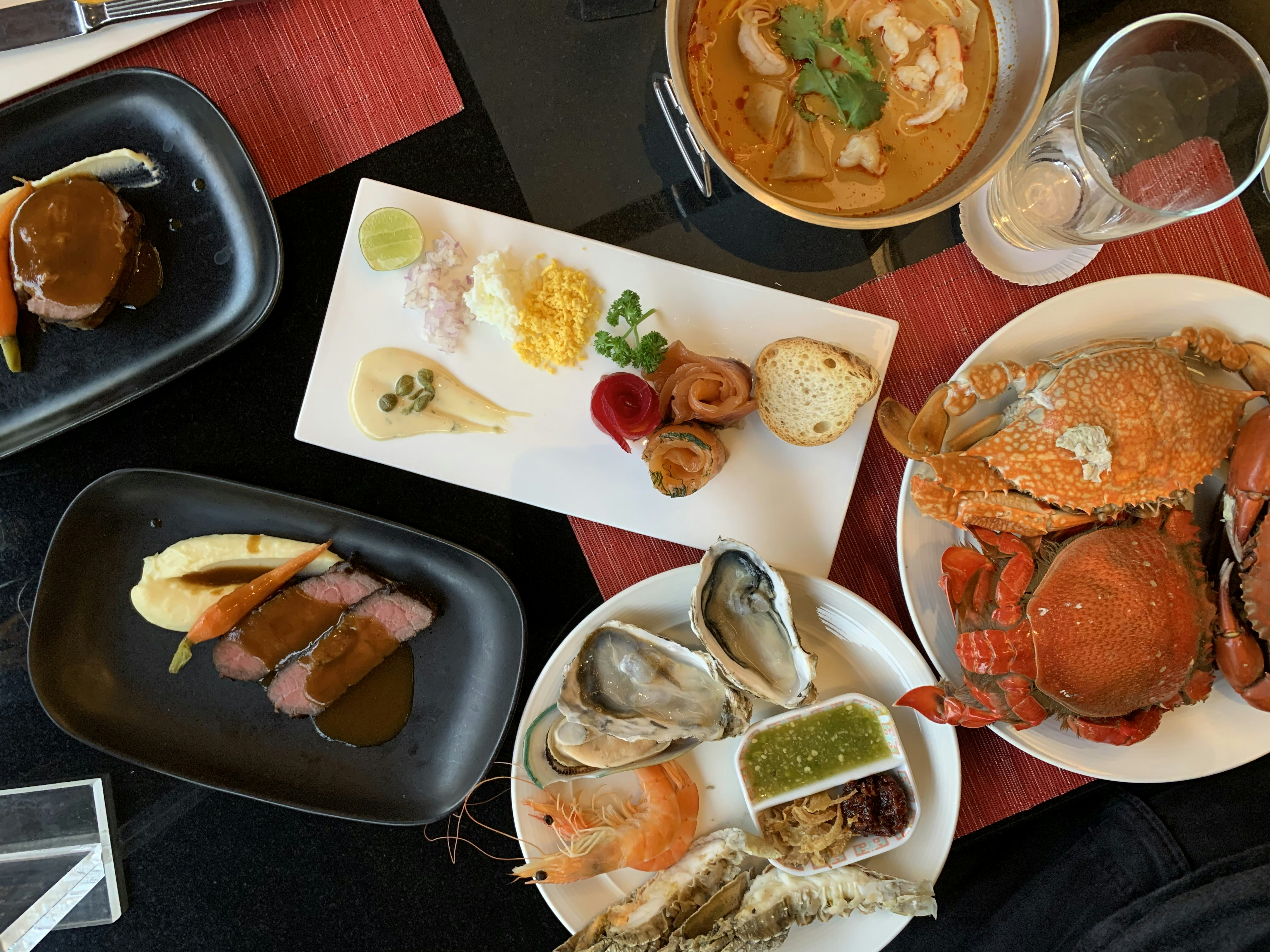 white ceramic bowl with foods on black table