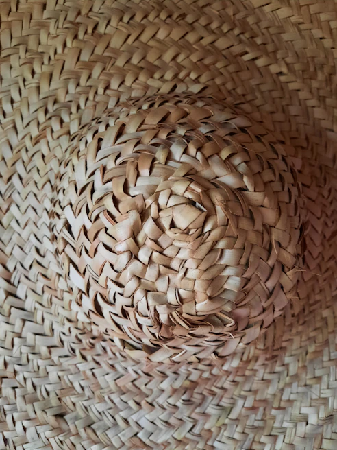 A close-up of a stylish hat with intricate stitching.