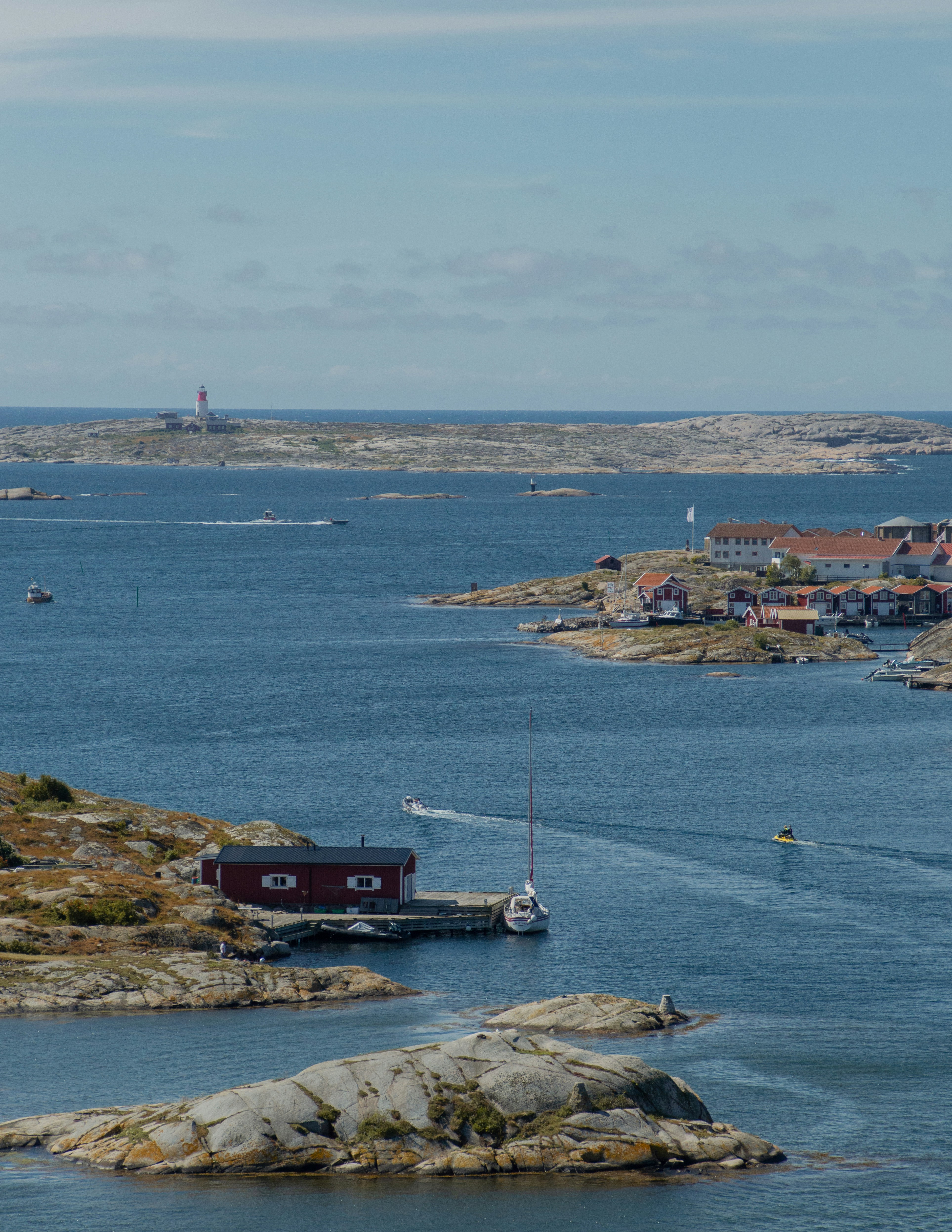 red and black ship on sea during daytime