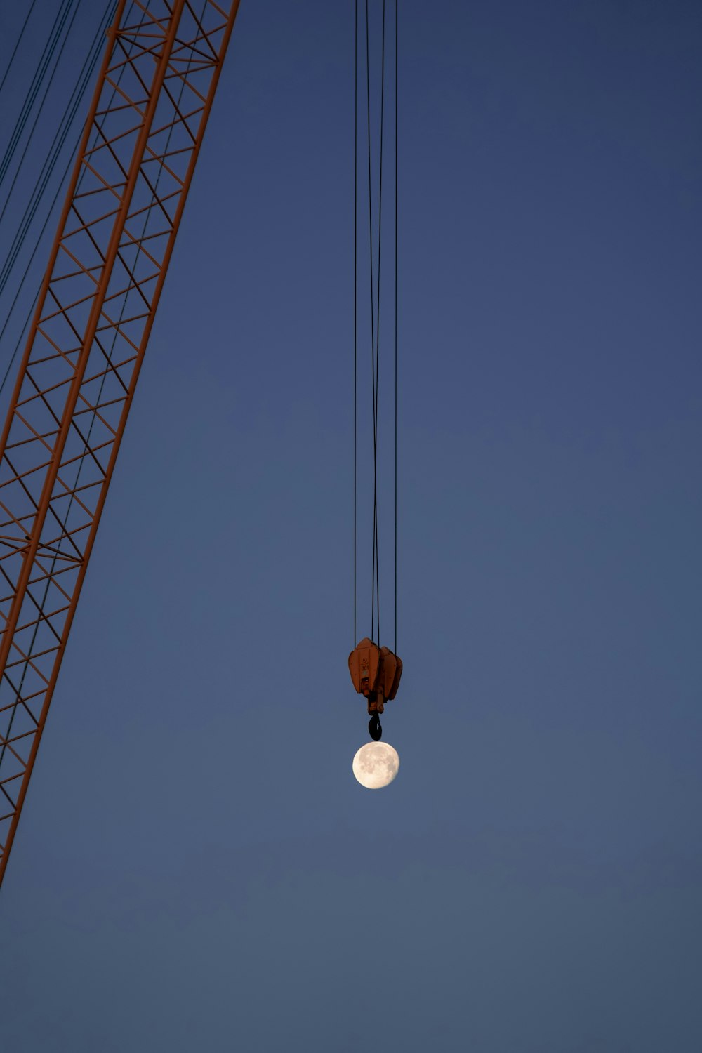 orange metal tower under blue sky