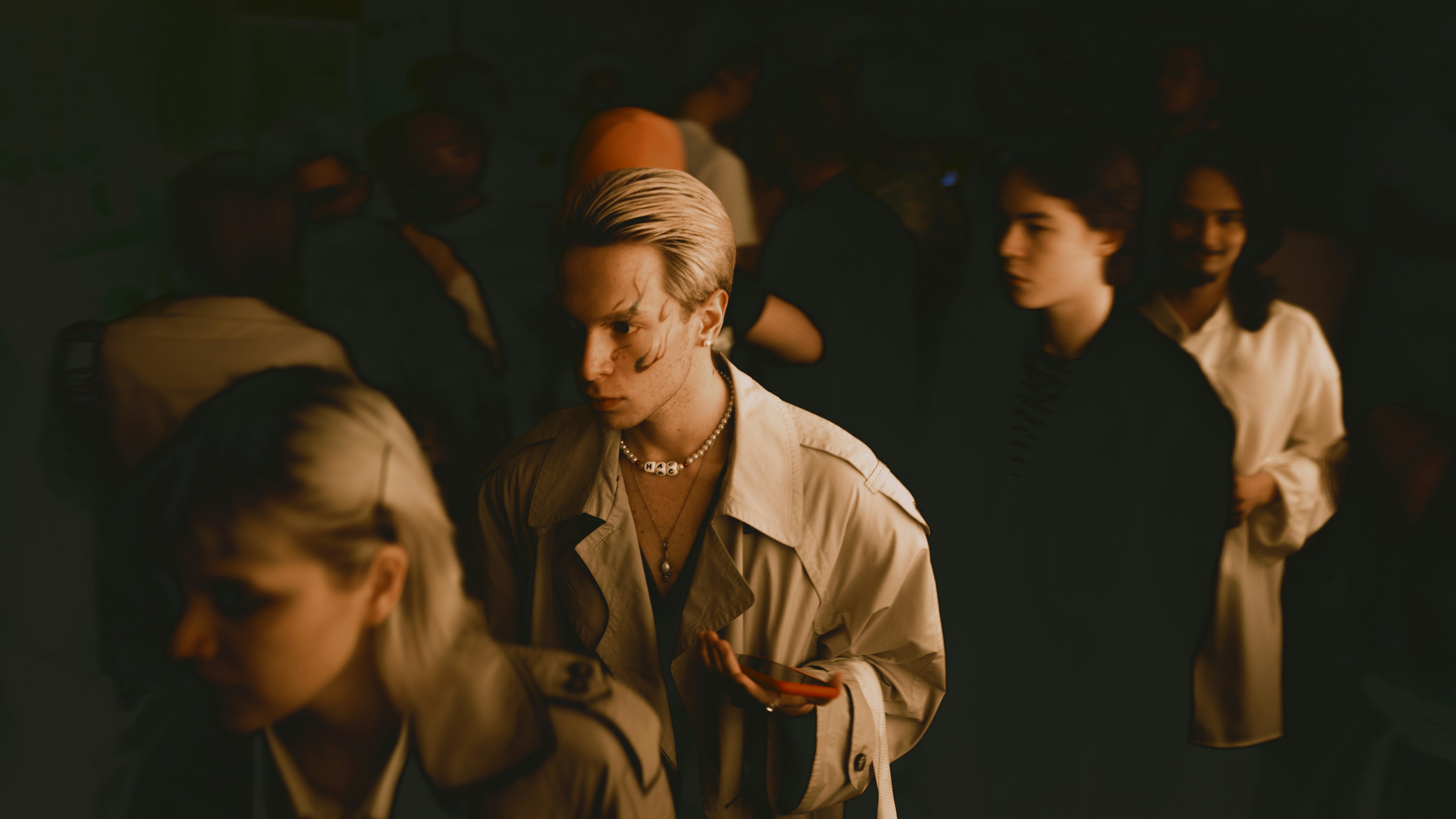 man in brown leather jacket standing beside woman in brown coat