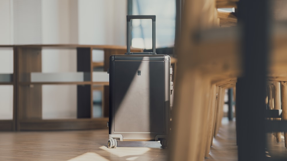 a piece of luggage sitting on top of a hard wood floor