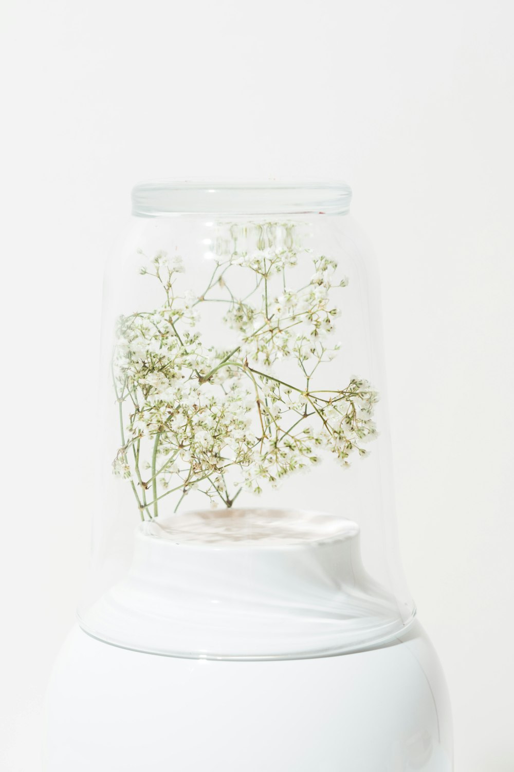 white and green floral glass vase