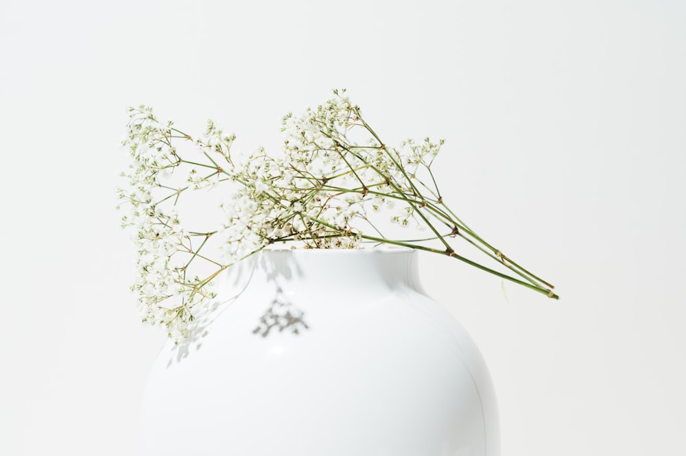 white and brown floral ceramic vase