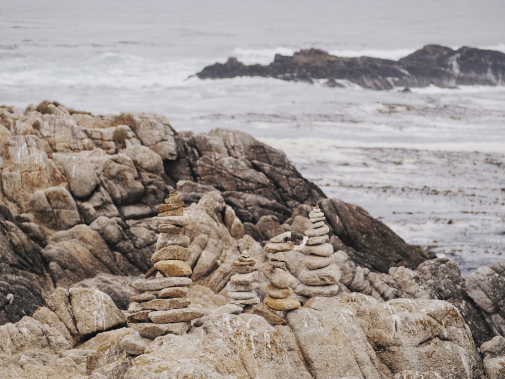 brown rock formation near sea during daytime