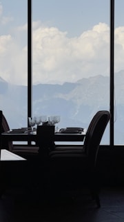 A beautifully set dining table with panoramic views of Poland's scenic landscape.