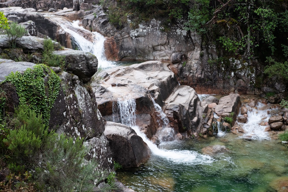 water falls on rocky mountain