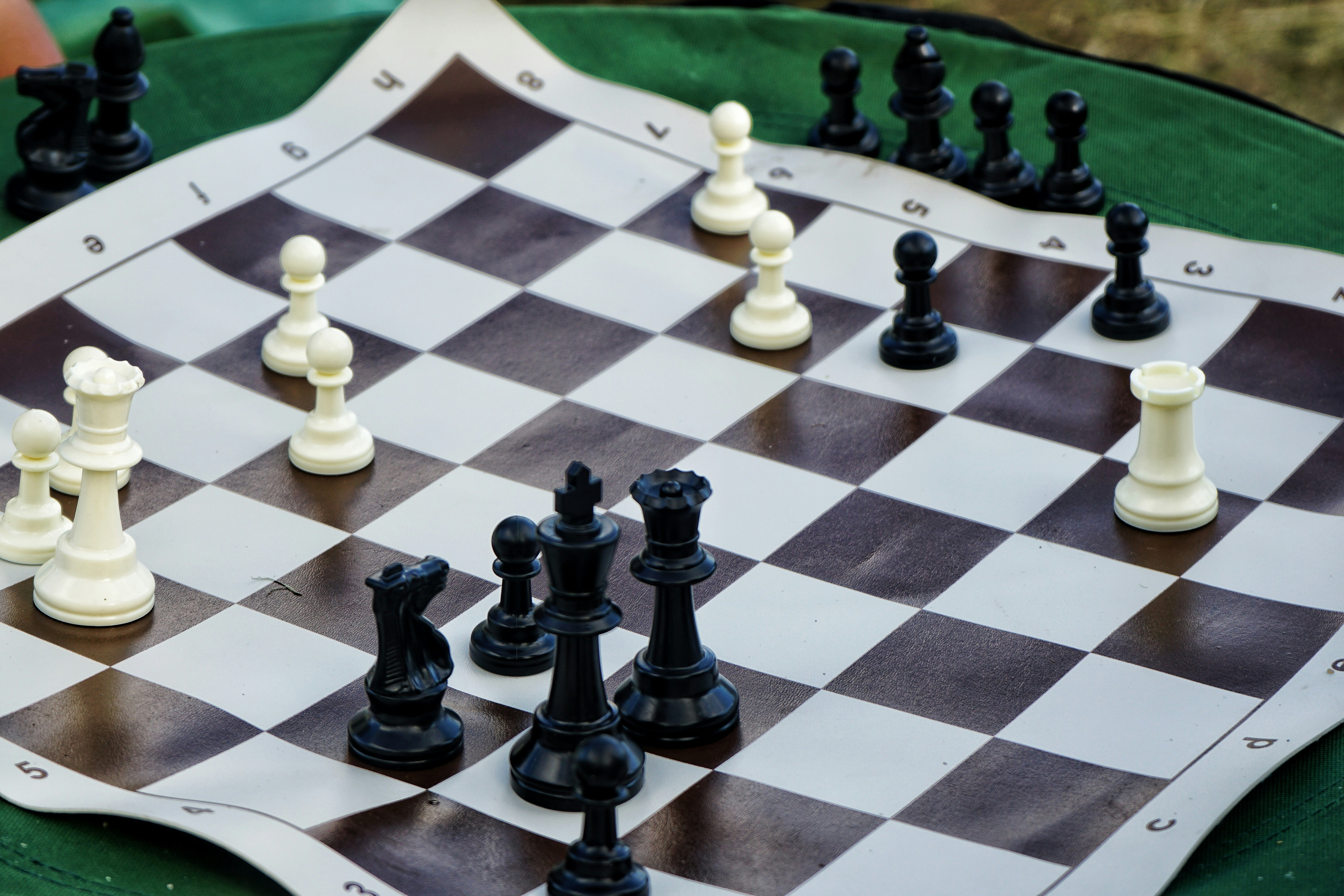 black and white chess piece on chess board