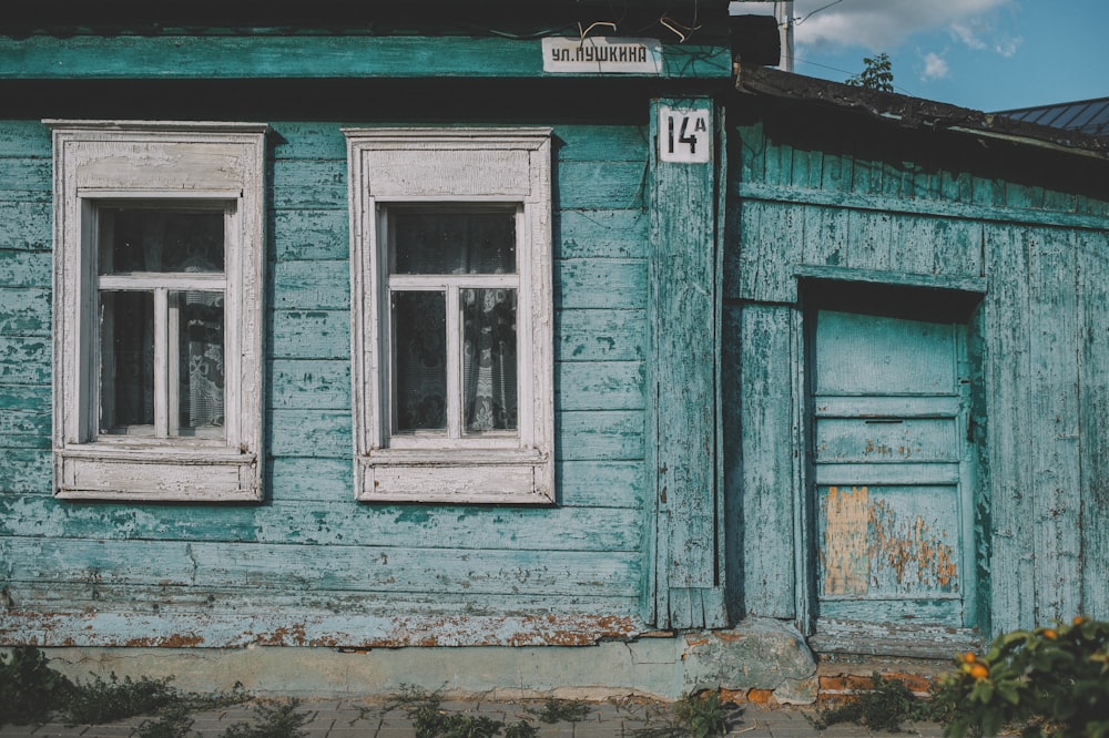 blue wooden window with white wooden frame