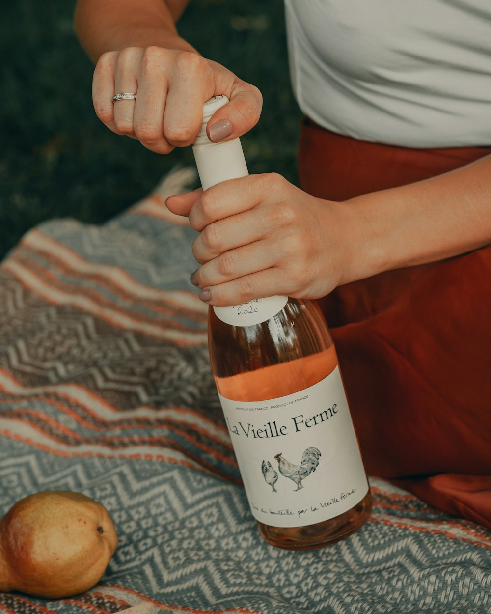 person holding white labeled bottle