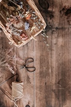 A rustic DIY prepper kit laid out on a wooden table with natural elements