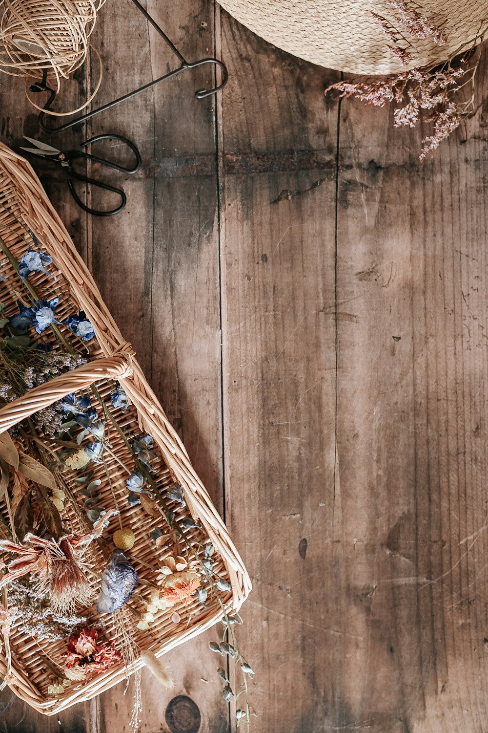 brown woven basket on brown wooden floor