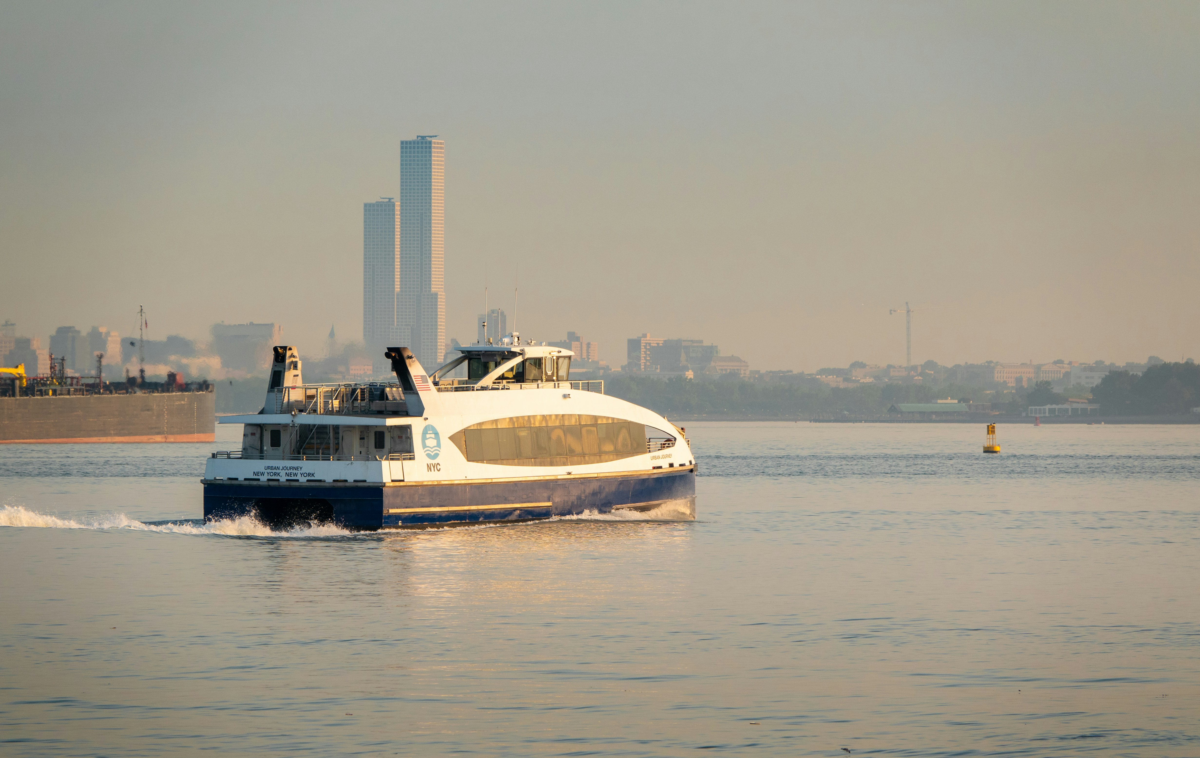 white and blue boat on water