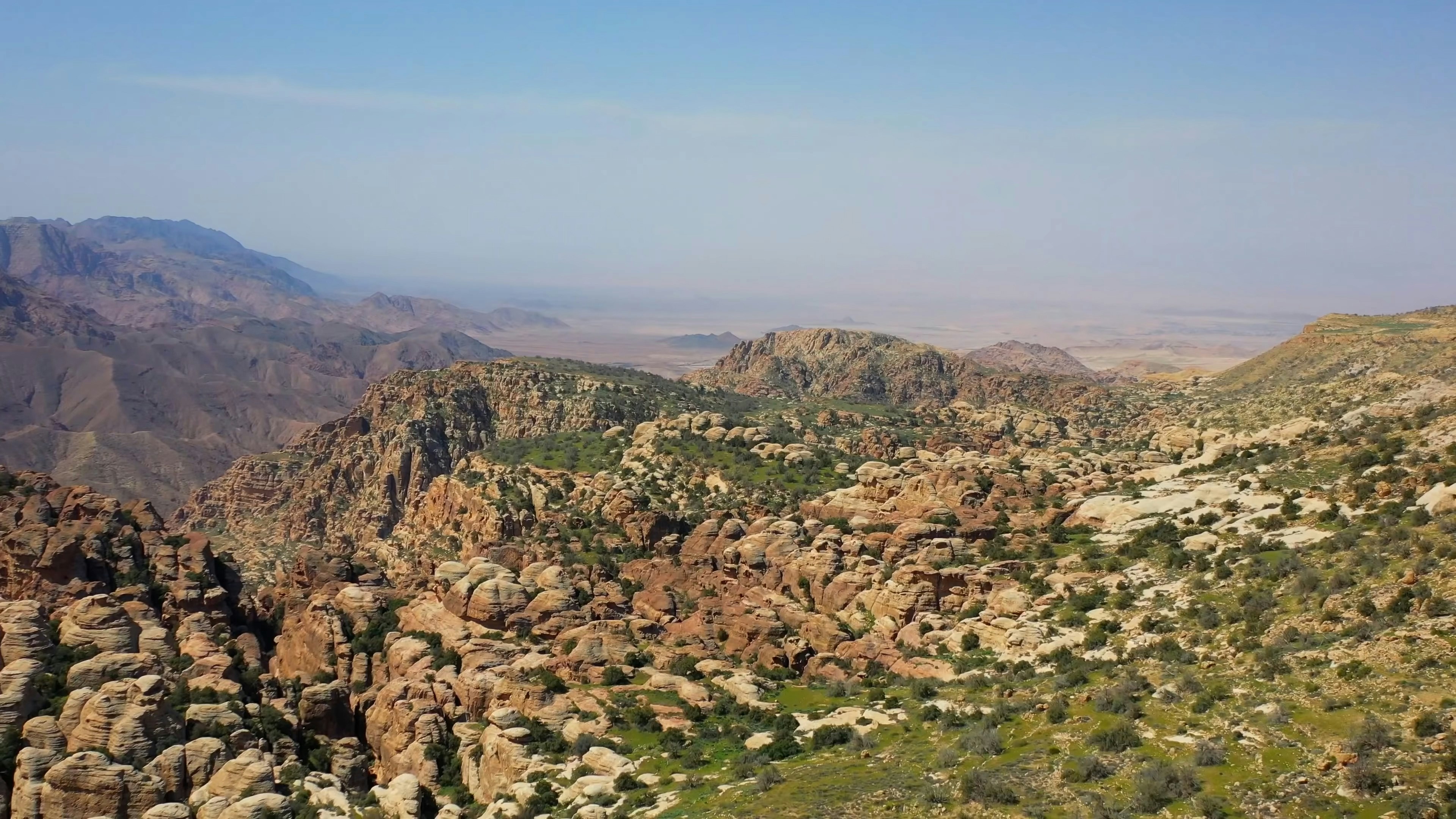 brown and green mountains under blue sky during daytime