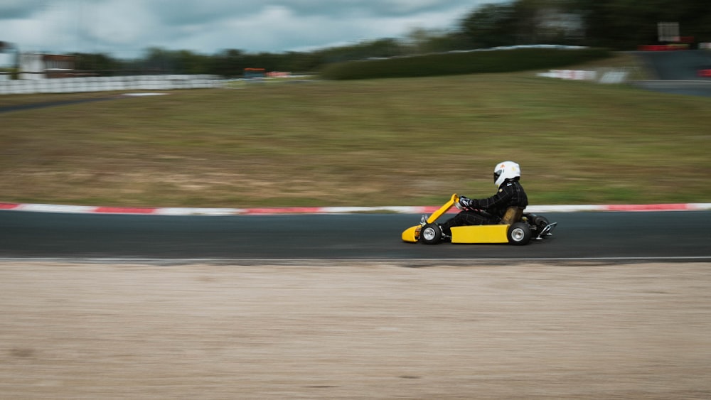 yellow and black go kart on track