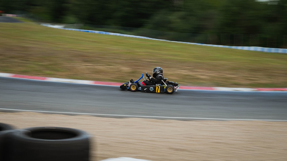 yellow and black go kart on track