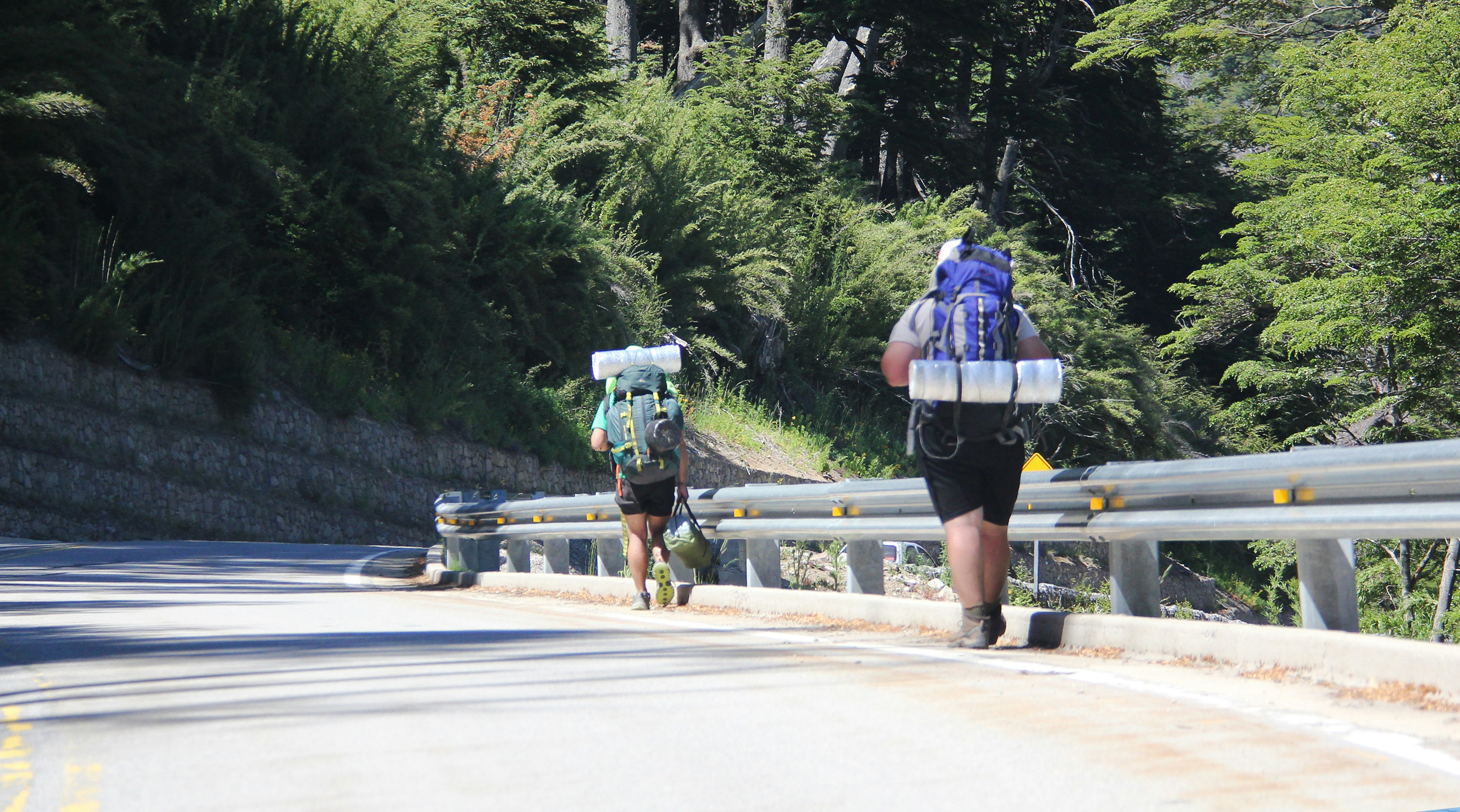 2 women walking on the road during daytime