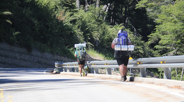 2 women walking on the road during daytime
