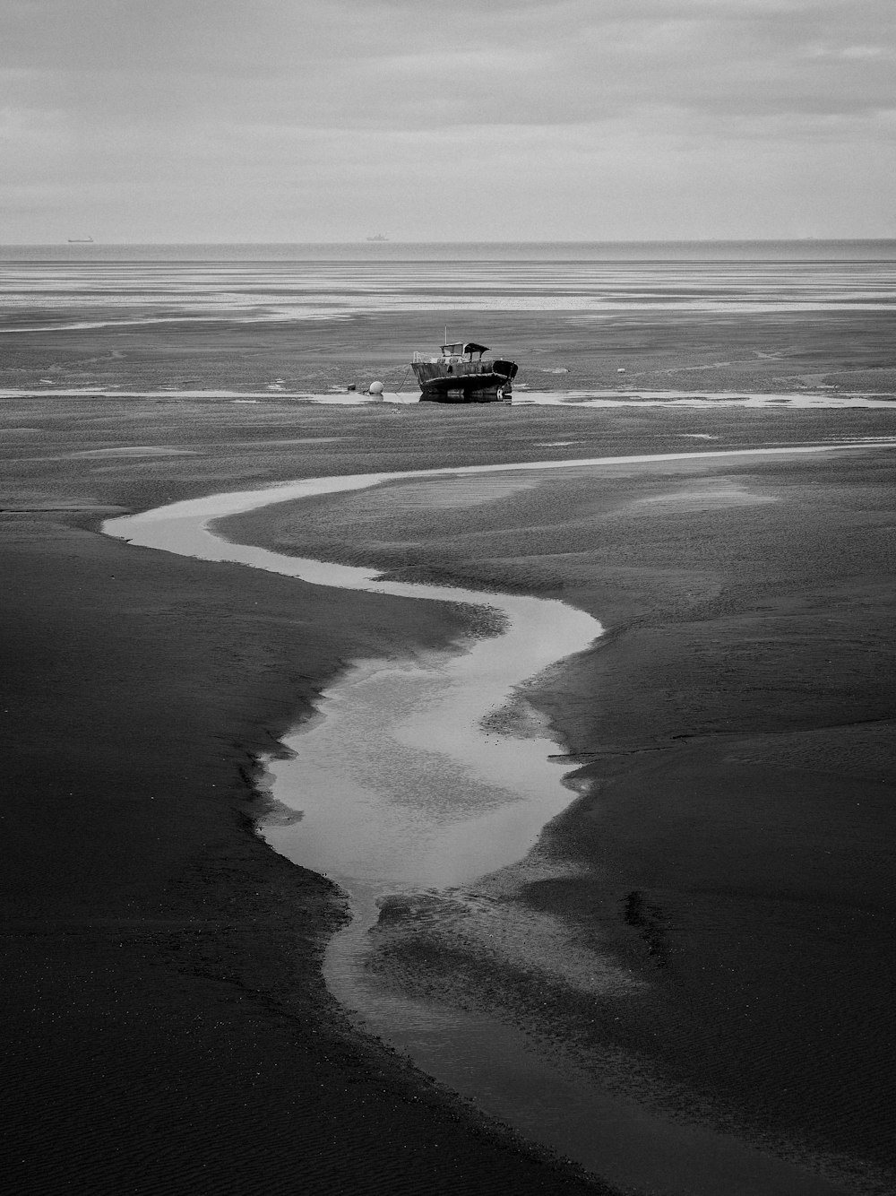 black and white boat on body of water during daytime