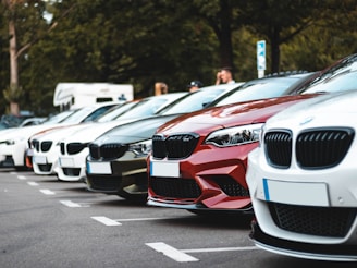 white and red bmw m 3 on road during daytime