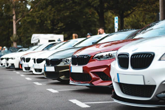 white and red bmw m 3 on road during daytime