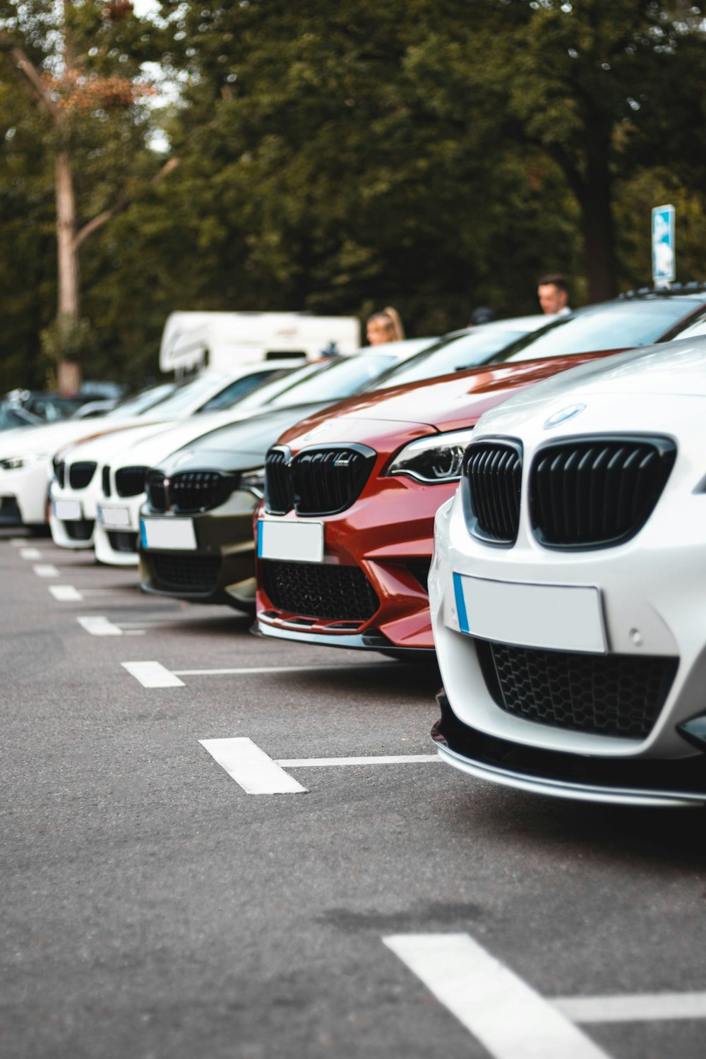 white and orange bmw m 3 on road during daytime