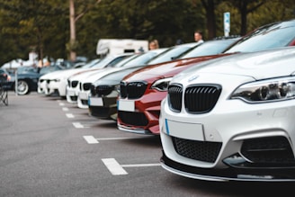 white and black bmw m 3 on road during daytime