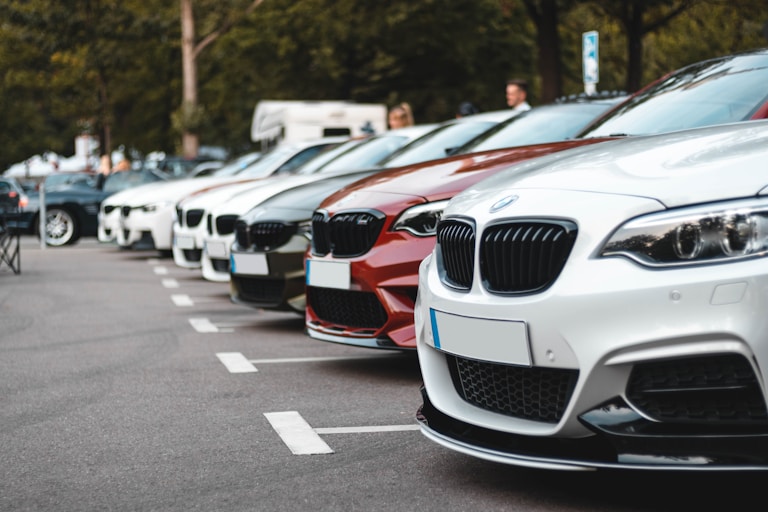 white and black bmw m 3 on road during daytime