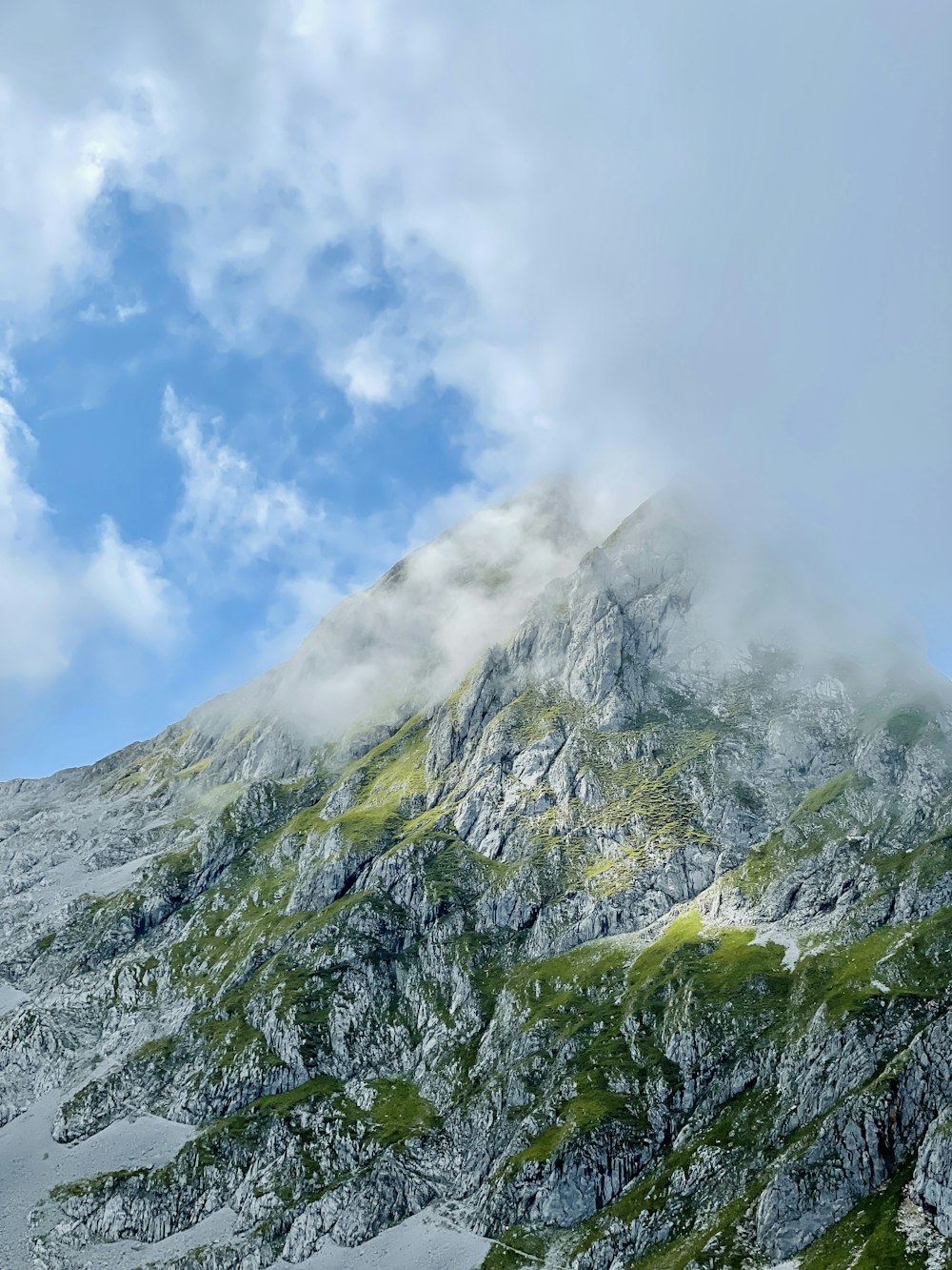 green and white mountain under blue sky during daytime