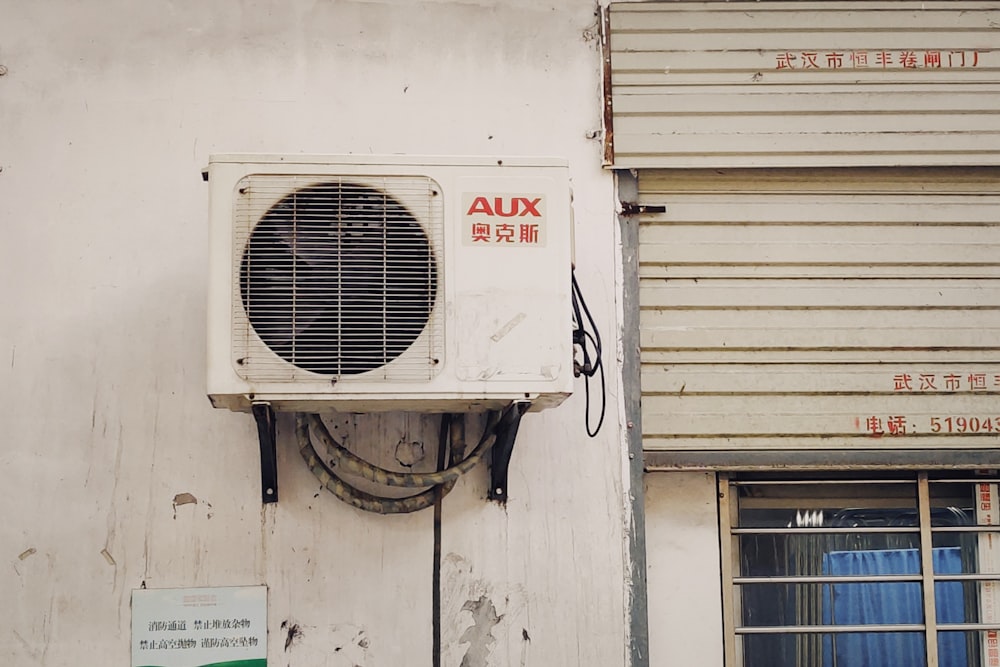 white and gray window type air conditioner