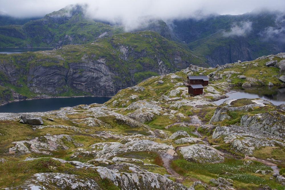 green and gray mountain beside body of water during daytime