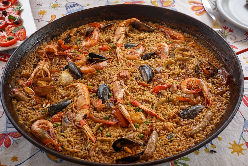 cooked food on black round plate