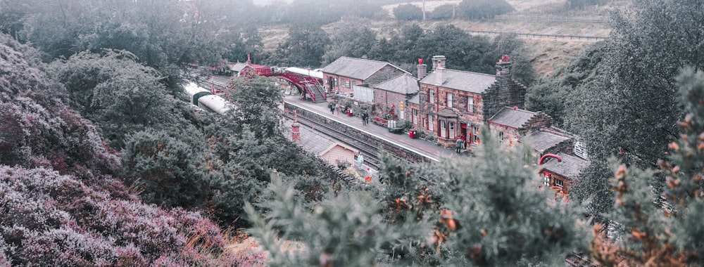 red and white train on rail tracks