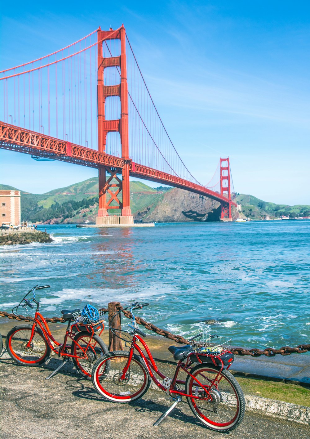 red and black bicycle on bridge during daytime