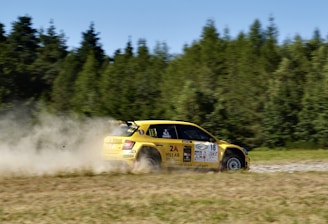 yellow and red race car on track during daytime