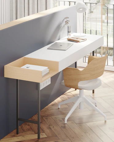 A modern minimalist workspace with chess pieces and strategy books scattered on a wooden desk.