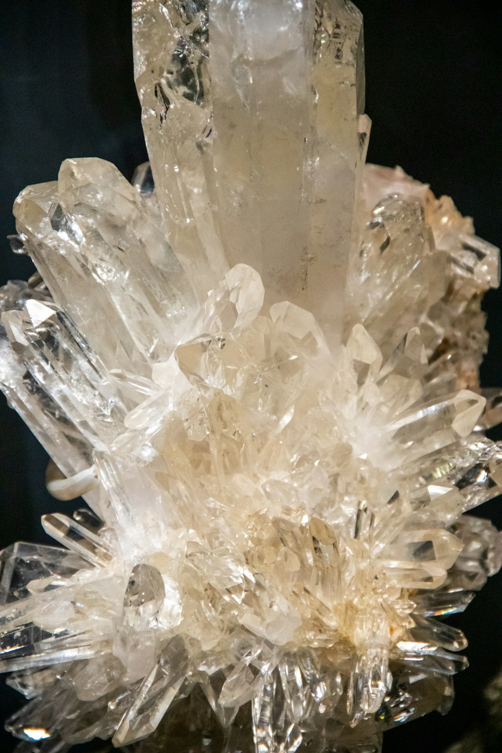 clear crystal stone on black surface