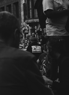 grayscale photo of people in street