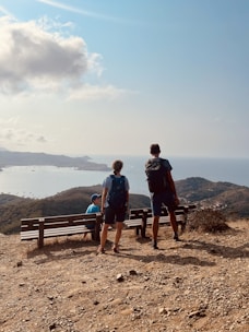 Happy travelers enjoying a panoramic view of Darjeeling hills.