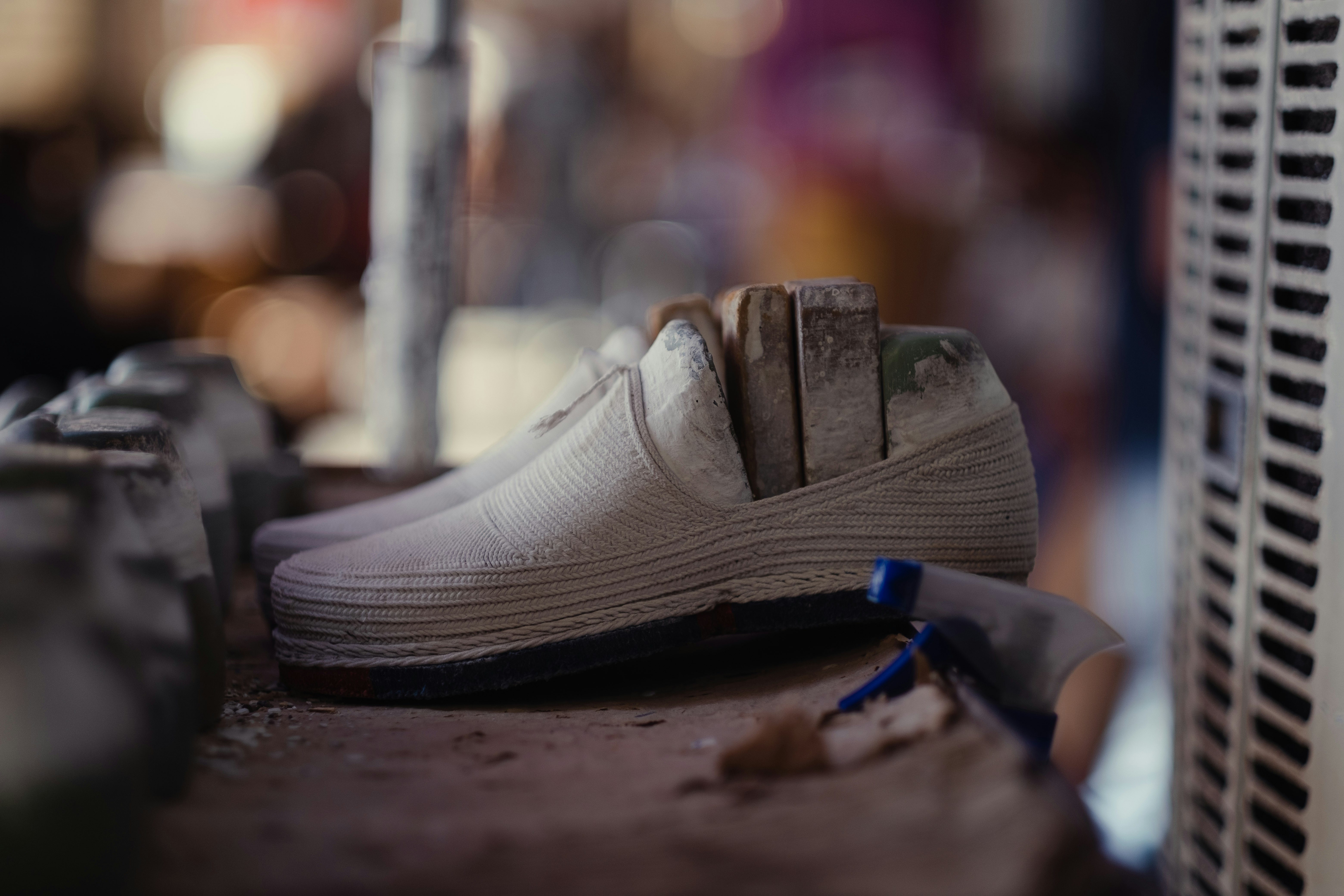 white nike athletic shoes on brown wooden table