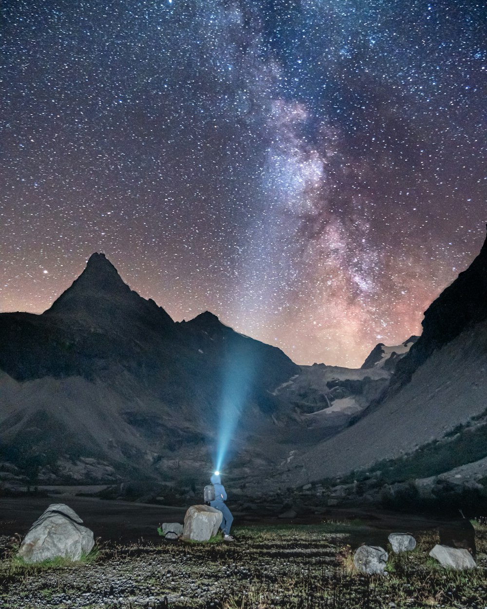 white and black mountains under starry night