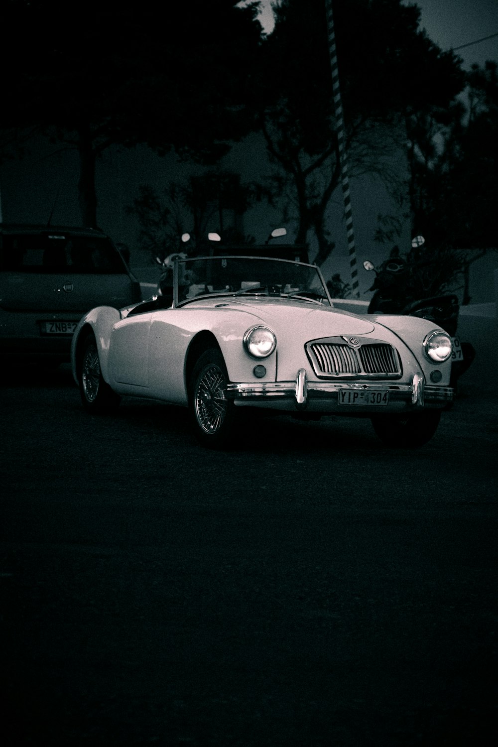 grayscale photo of mercedes benz coupe