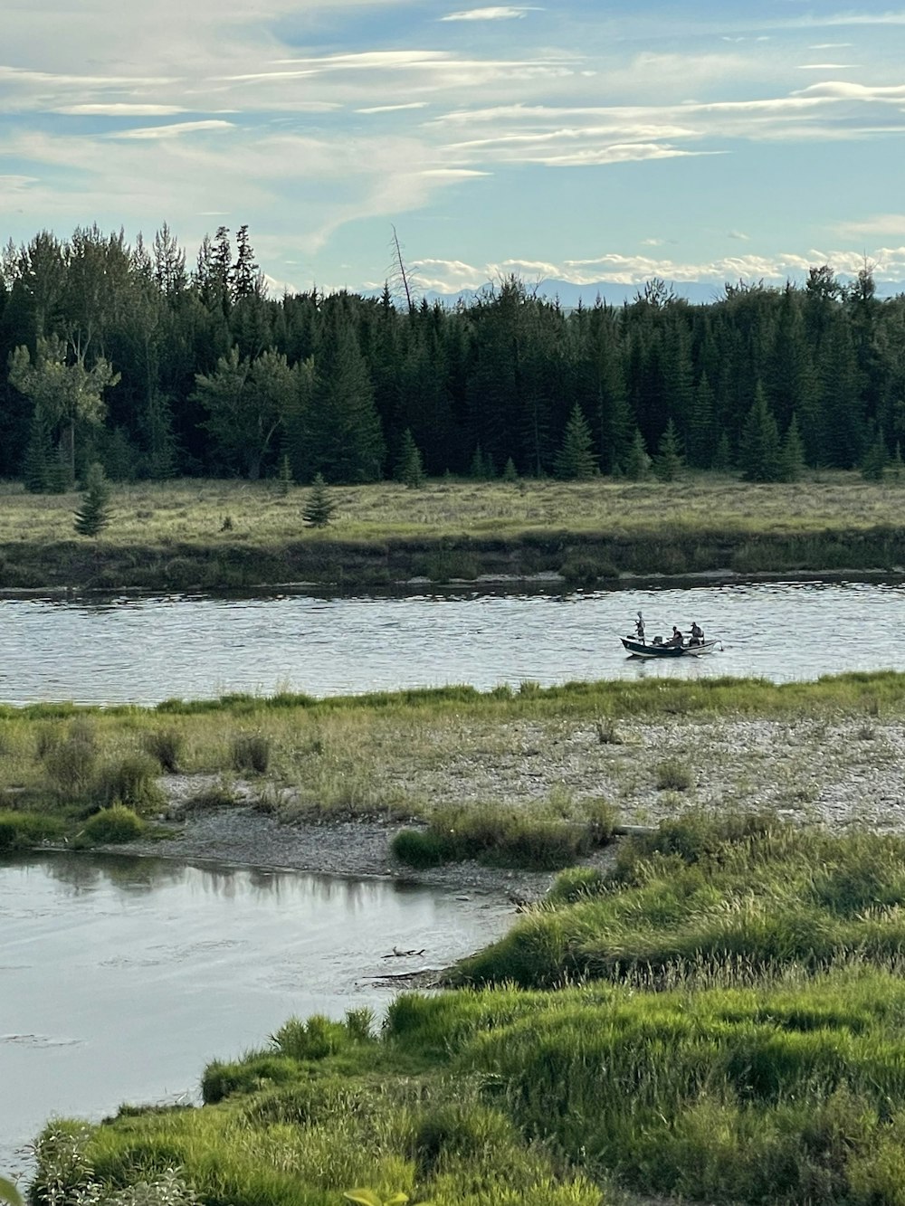 person riding on boat on river during daytime