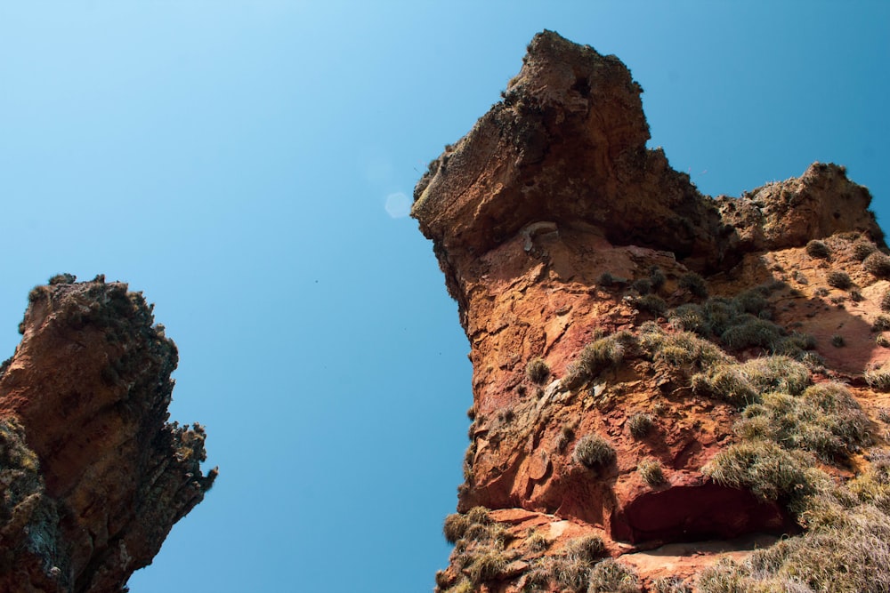 brown rock formation under blue sky during daytime