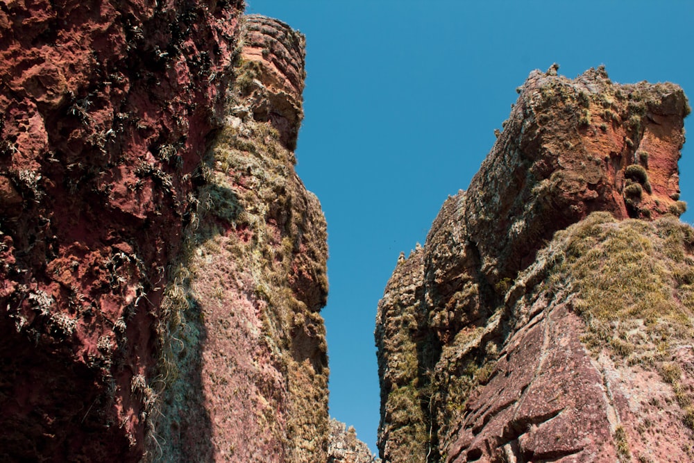 brown rocky mountain under blue sky during daytime