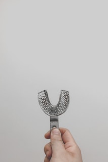 silver and black studded accessory