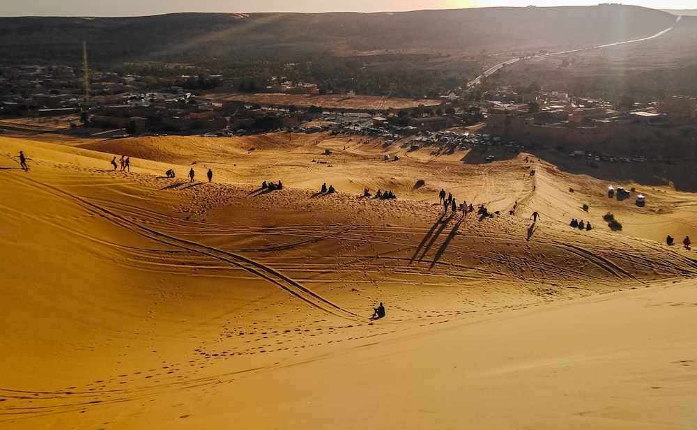 people walking on desert during daytime