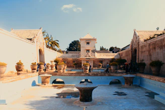 white concrete building near body of water during daytime