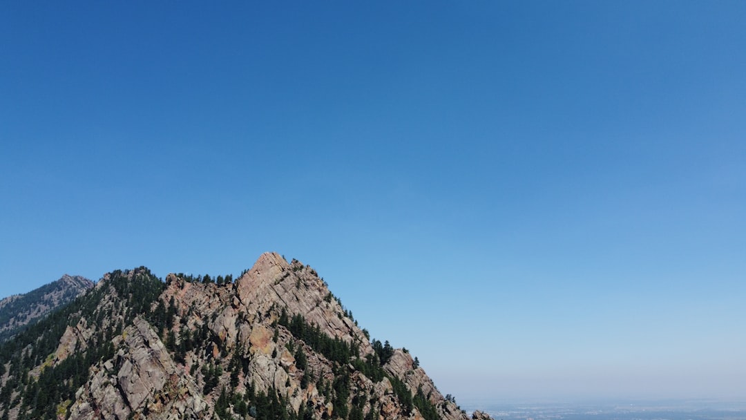 brown rocky mountain under blue sky during daytime