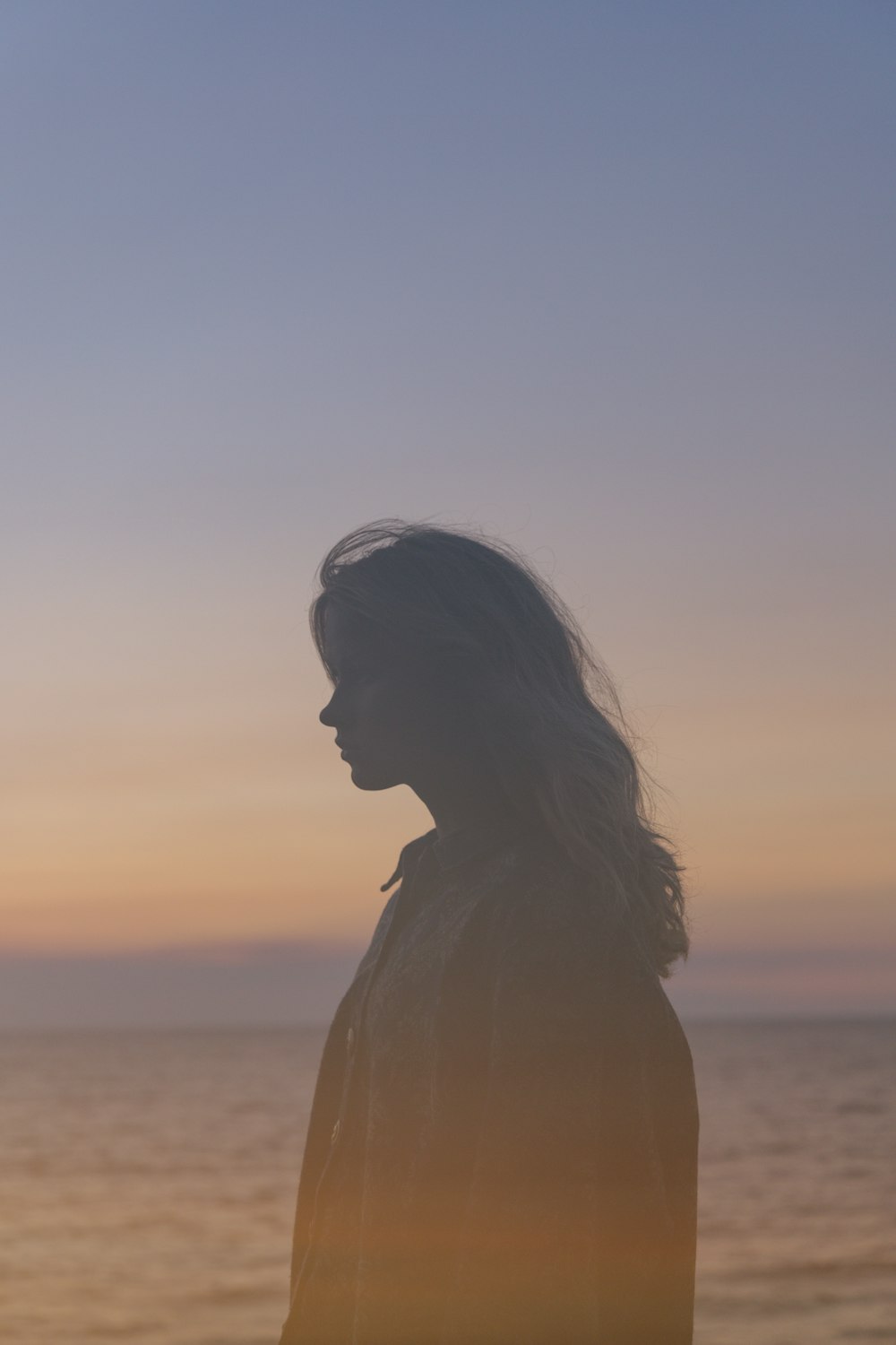 silhouette of woman during sunset